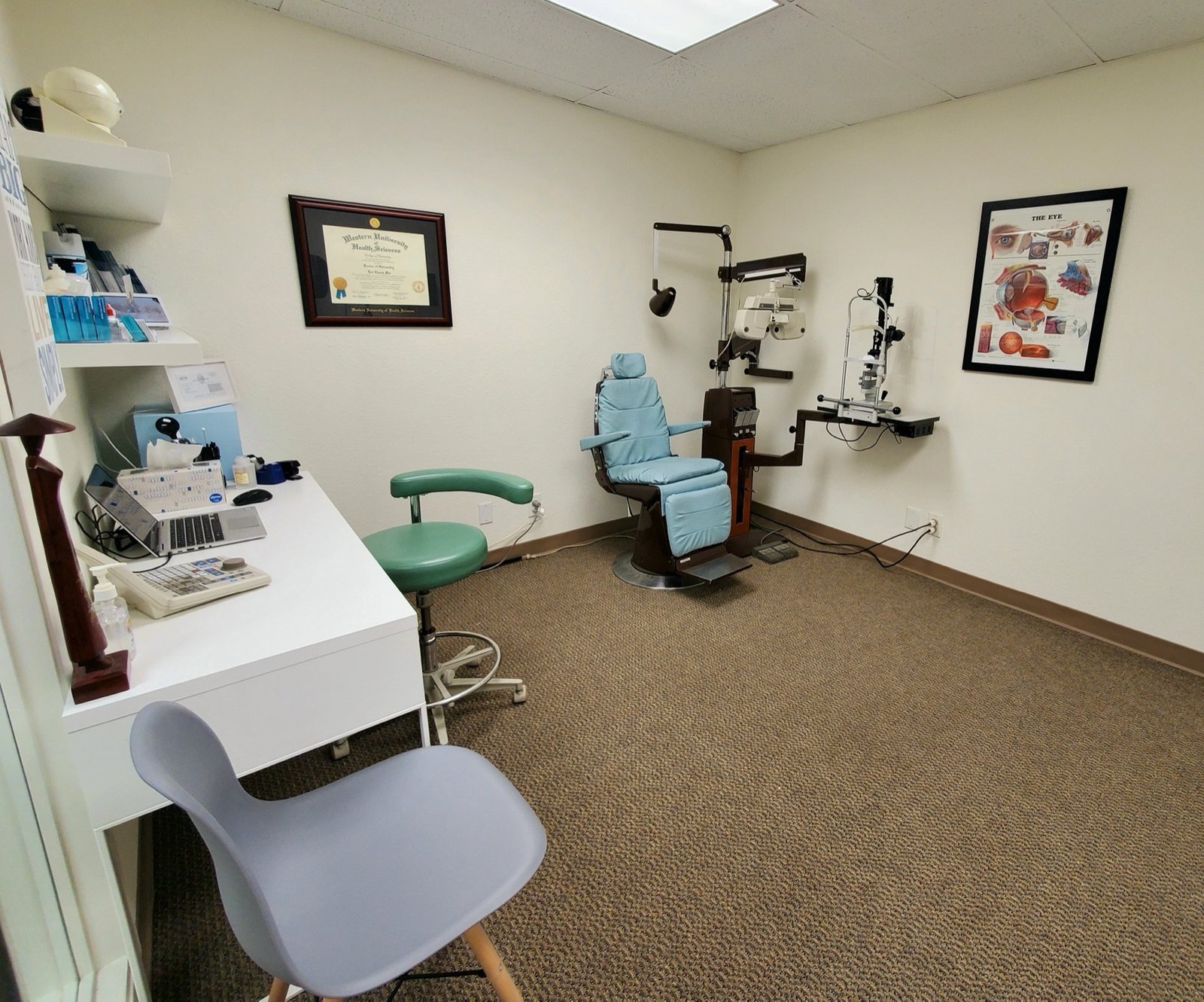 Examination lane at Luminous Optometry with exam chair, phoropter and slit lamp