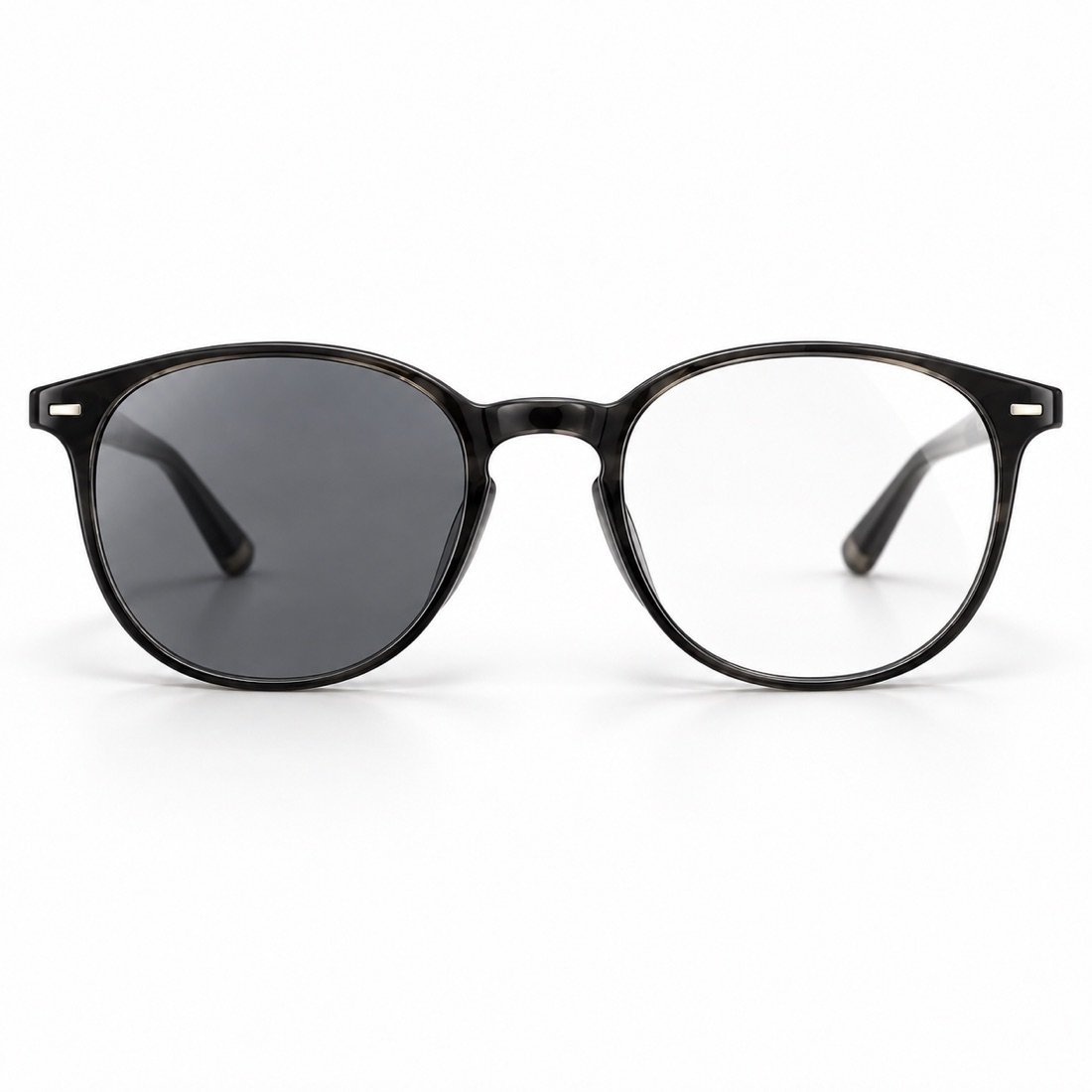 A pair of glasses with one photochromic lens darkened and the other still clear