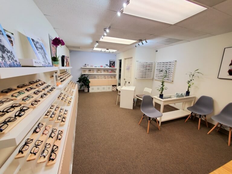 The optical at Luminous Optometry in Santa Ana, with frame boards along one wall and seating for fittings