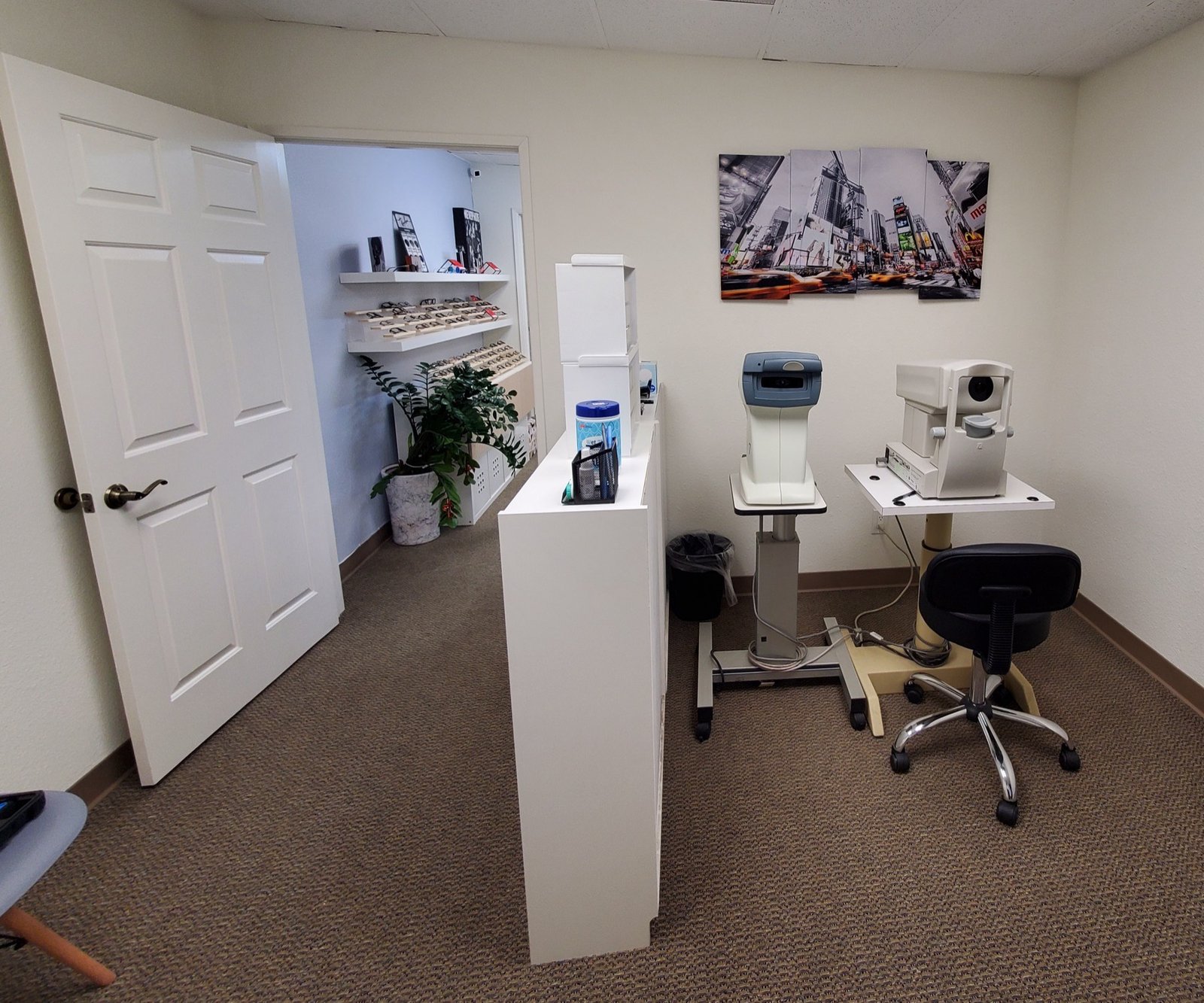 Pre-testing room with autorefractor and retinal imaging equipment